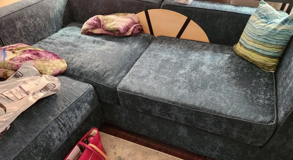 Grey velvet cover in a lovesac sofa