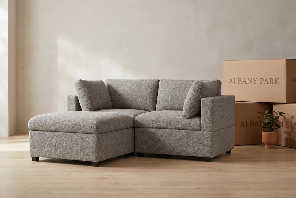 The Albany Park Kova sofa-in-a-box shown with its branded shipping boxes