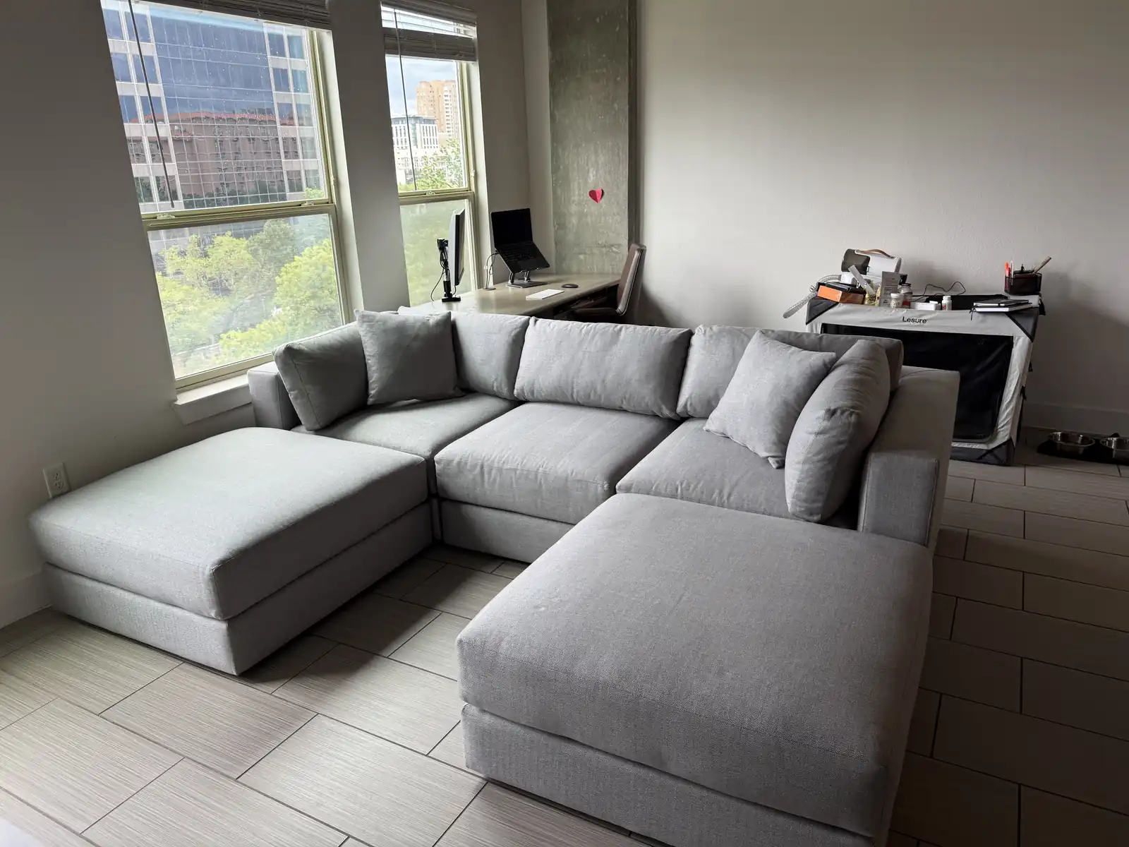 The DreamSofa Landon Modular arranged as a chaise U in a living room, in light gray Catalina Steel