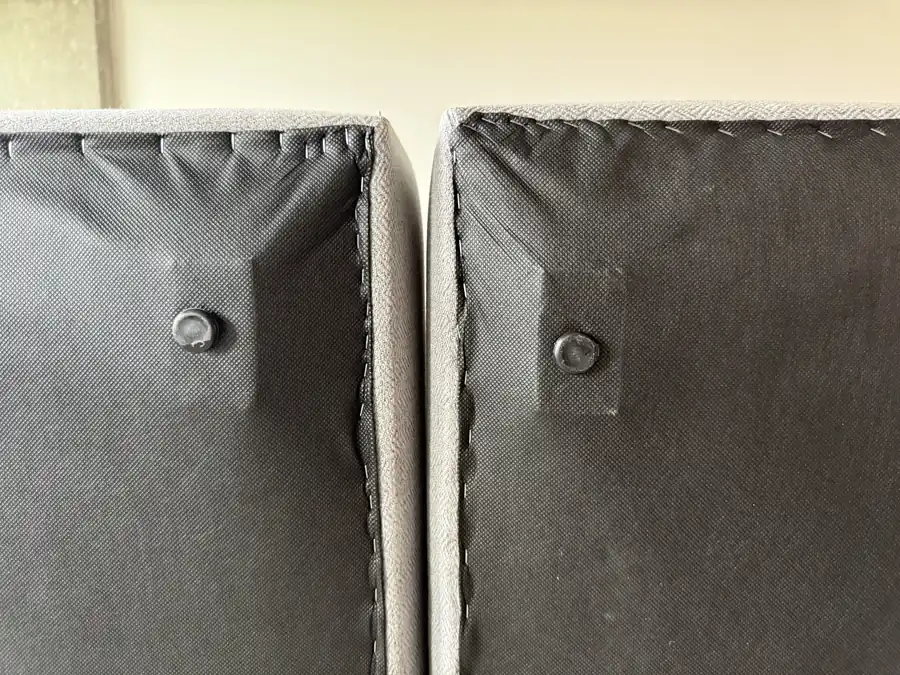 Plastic glide pins on the underside of two Landon modules