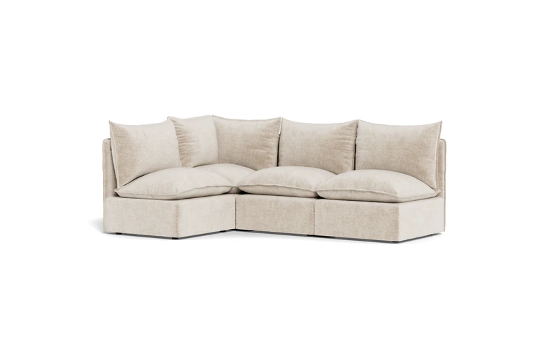 Light gray modular couch from Cozey in a bright open apartment in Dallas