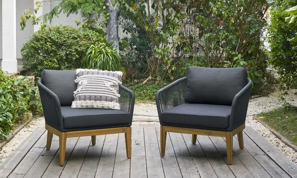 2 Lounge Chair Set with wooden frame and dark grey cushions in an outdoor patio.