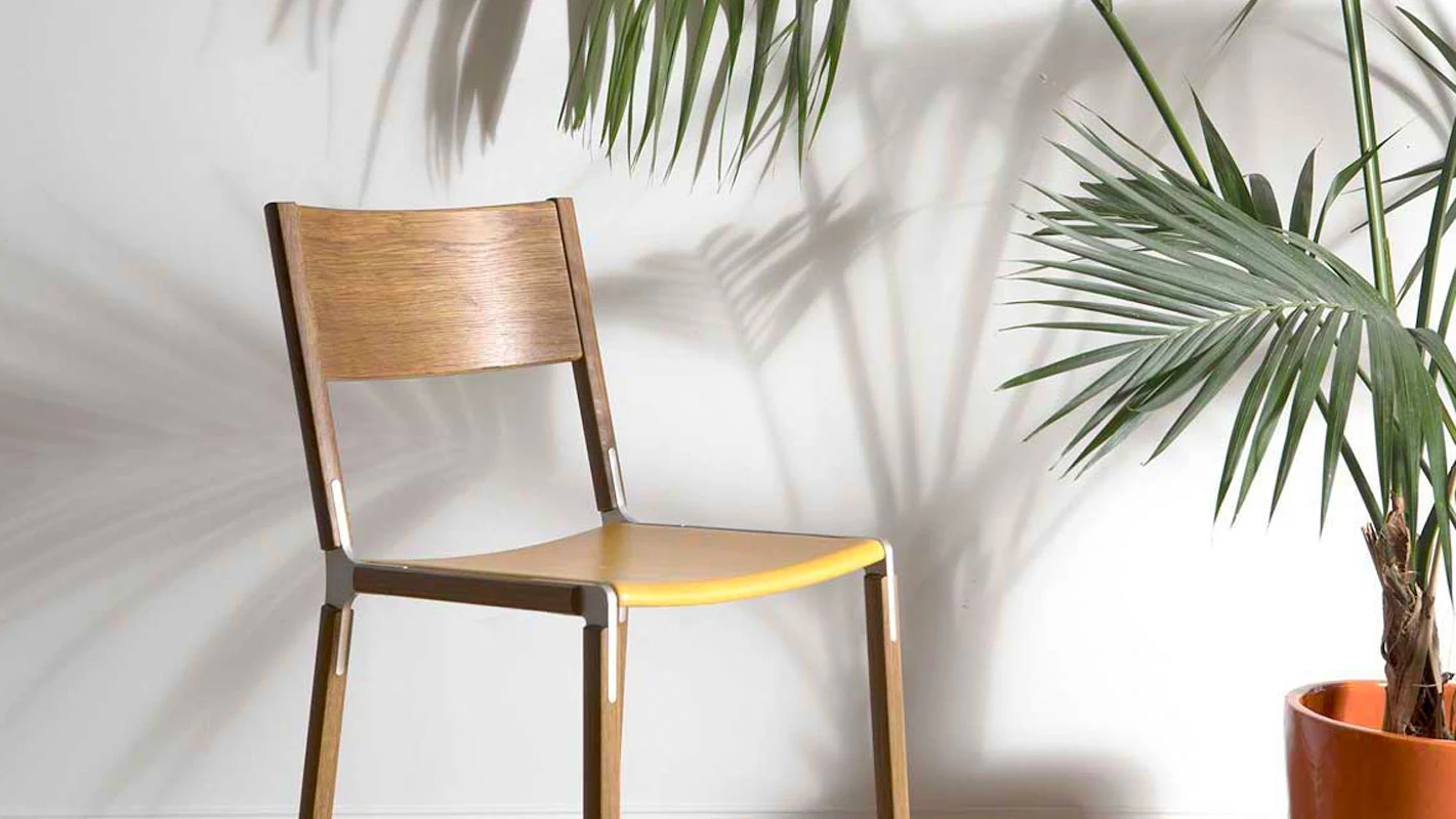 Wooden Counter Stool next to a palm tree