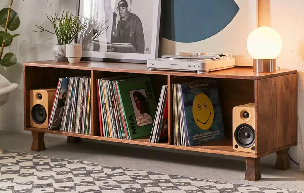 Wooden low credenza with a collection of vinils