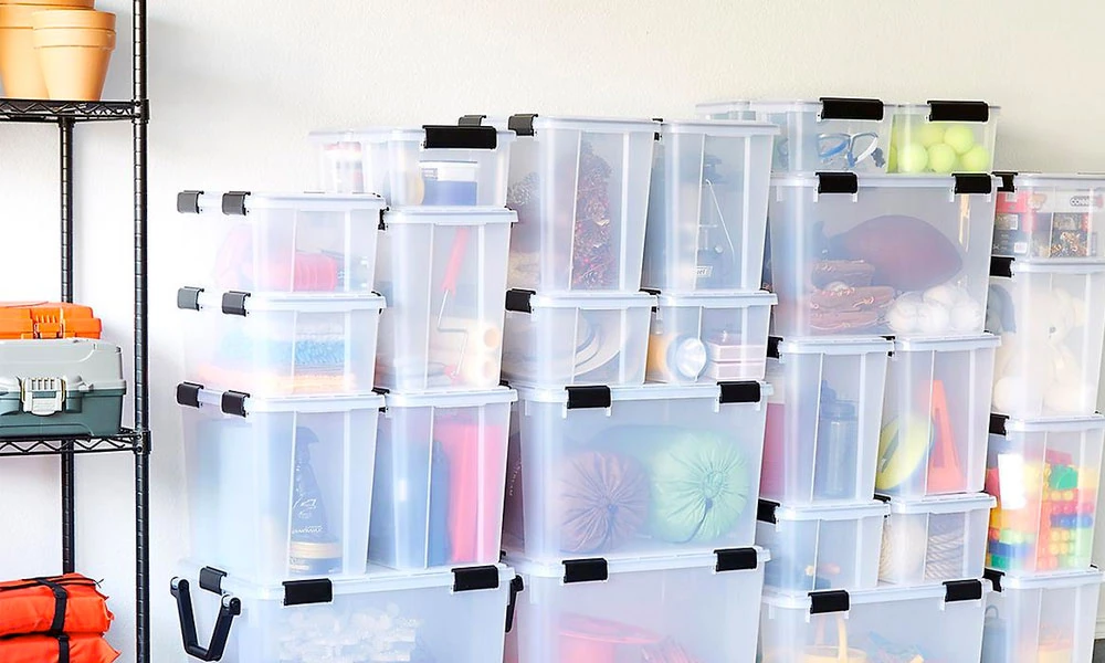 Clear Weathertight Totes Cases with stored stuff and stacked in a room