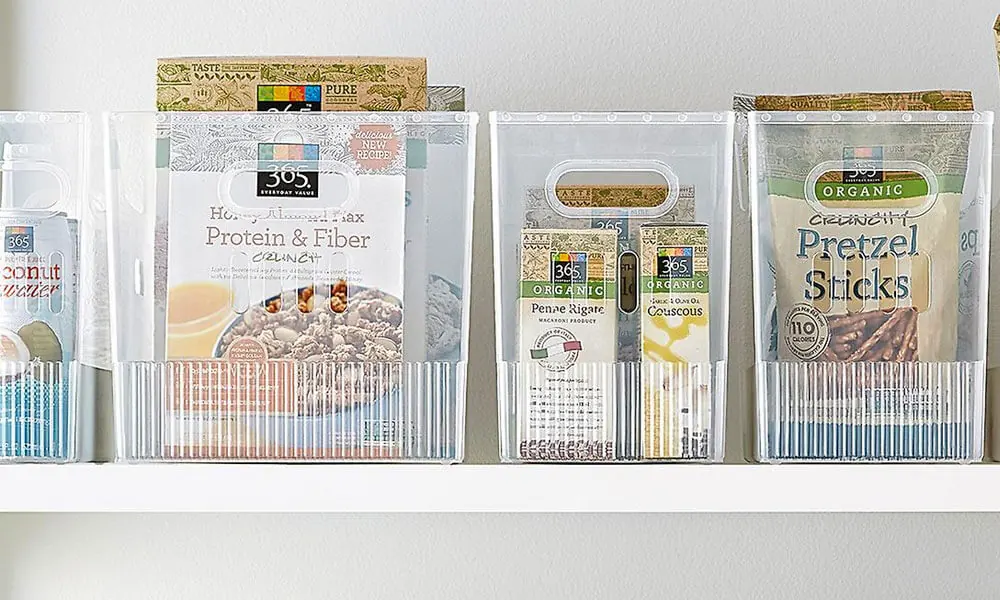 clear bins with food in it in a white shelf