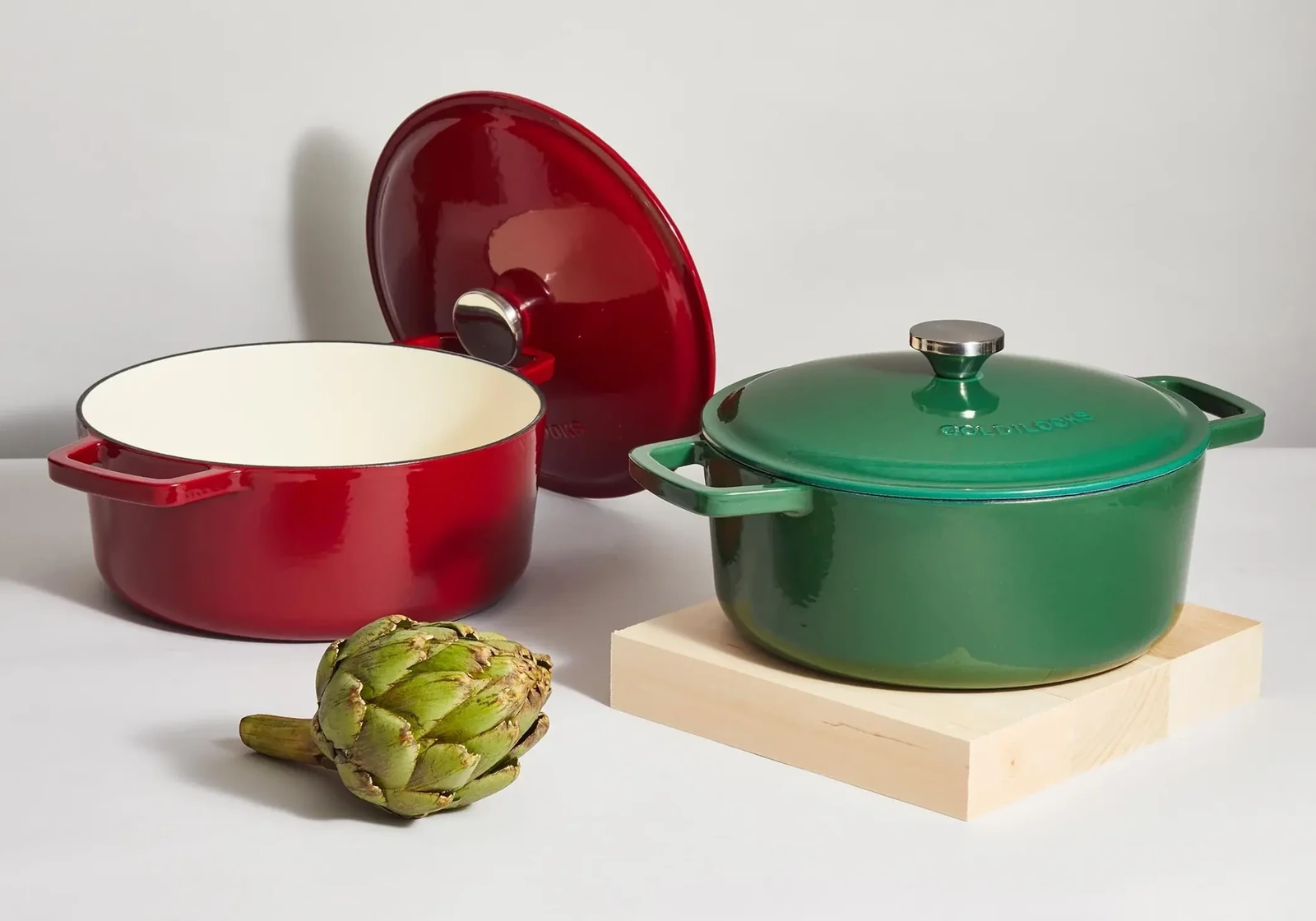 set of red and green pots in a white surface