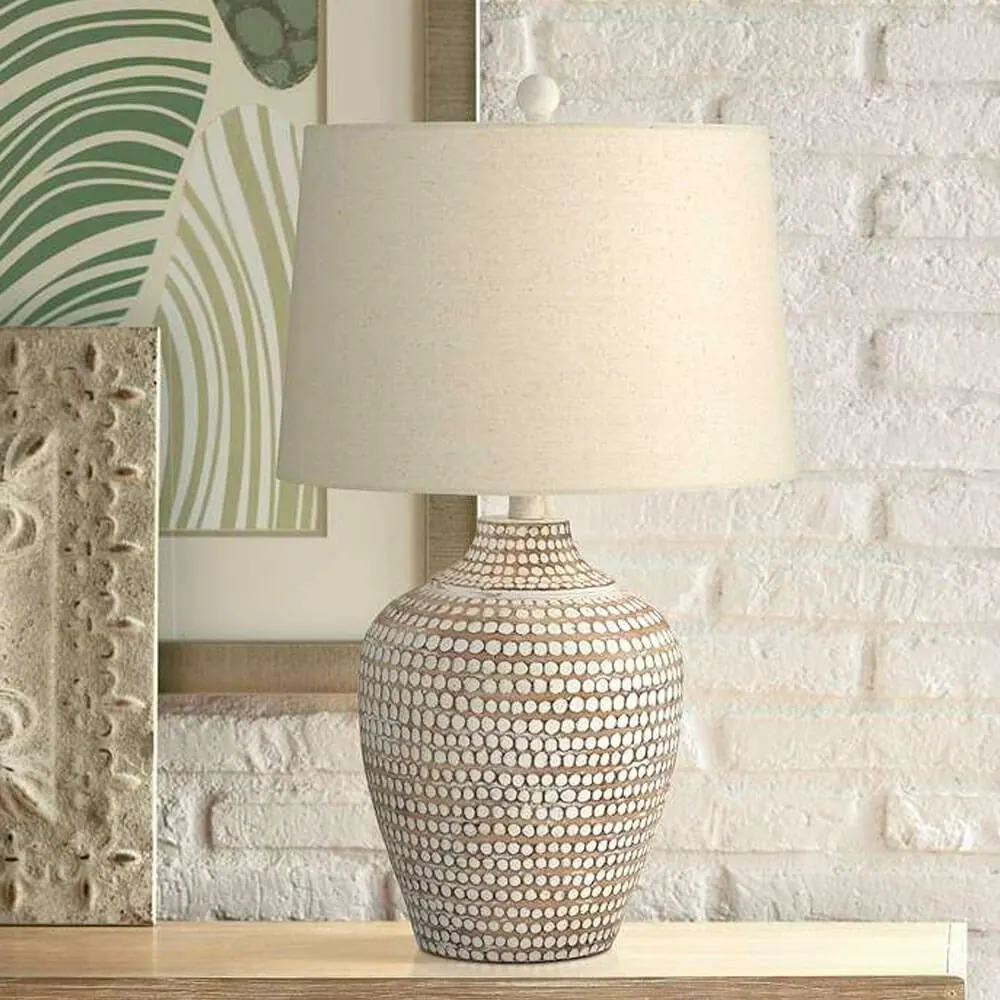  Neutral Earth Polka Dot Jug Table Lamp in a table near artwork in the wall
