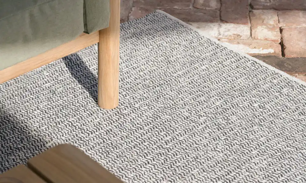 Grey Braid Rug with a couch 