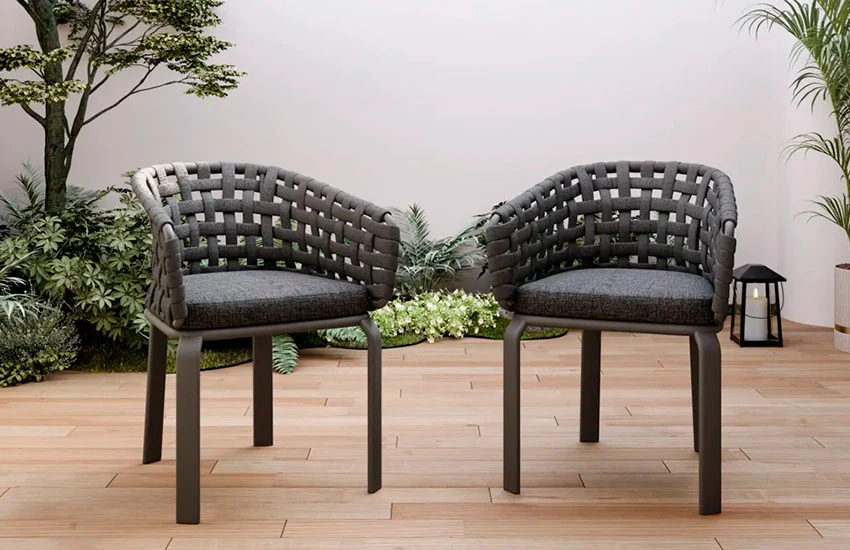 Dark brown wicker chairs with grey cushions 