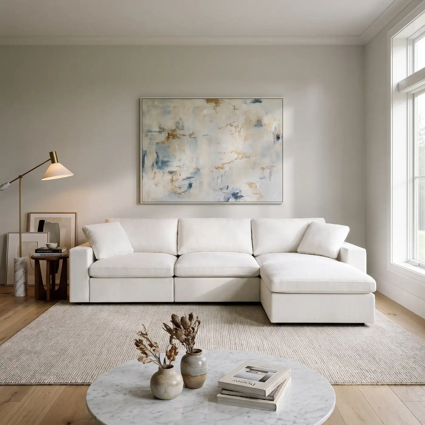 7th Avenue 3-Seat Modular Chaise Sectional in white, right-facing chaise, in a bright living room with a jute rug and round marble coffee table
