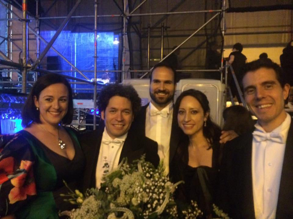 Lidia Vinyes Curtis with Gustavo Dudamel and team outside