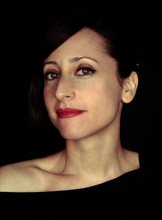 Portrait of Lidia Vinyes Curtis taken from the front with black background behind