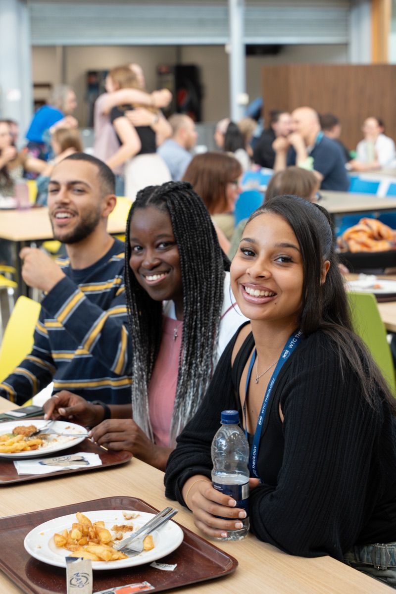 Smiling students sharing lunch