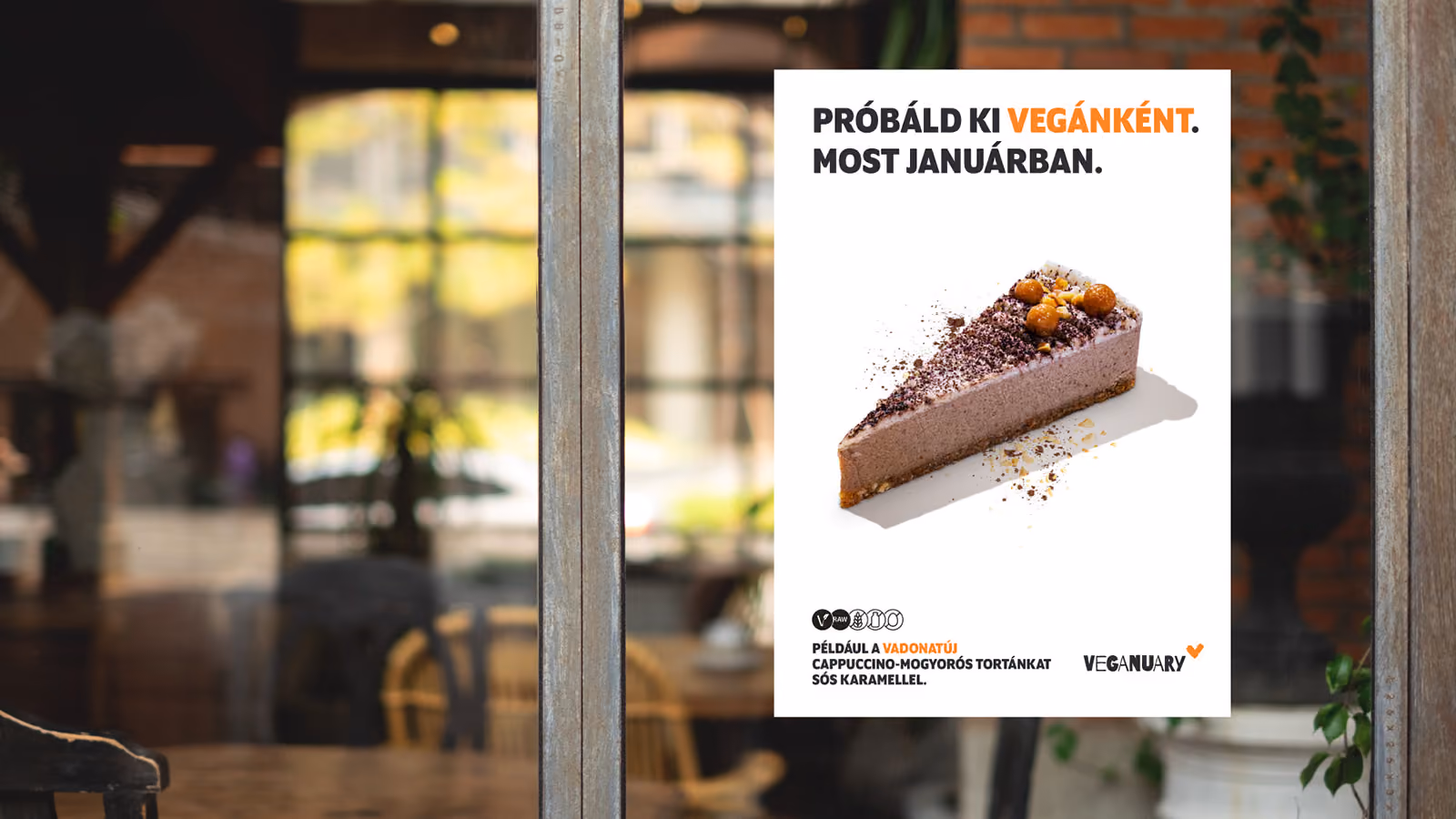 Ein Plakat, das Veganuary in einem Café-Schaufenster bewirbt