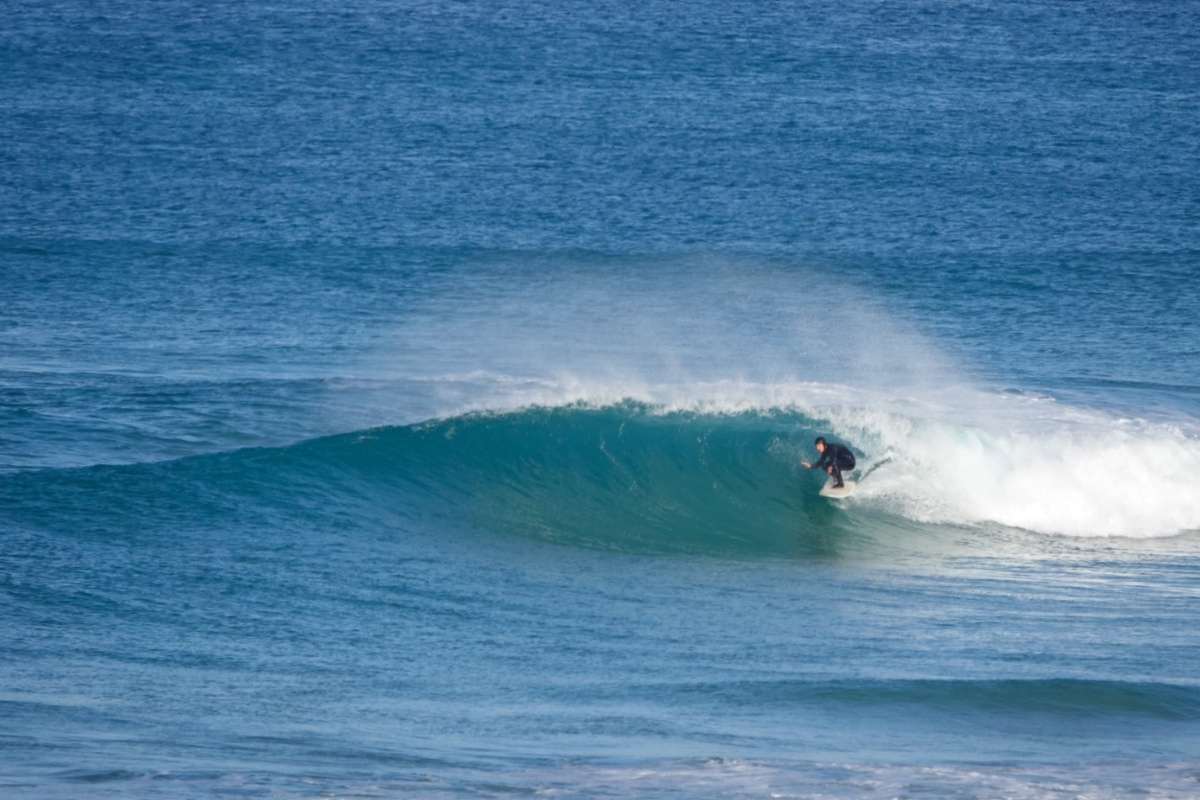 surfer getting some shade - winter in santa cruz, Central Portugal