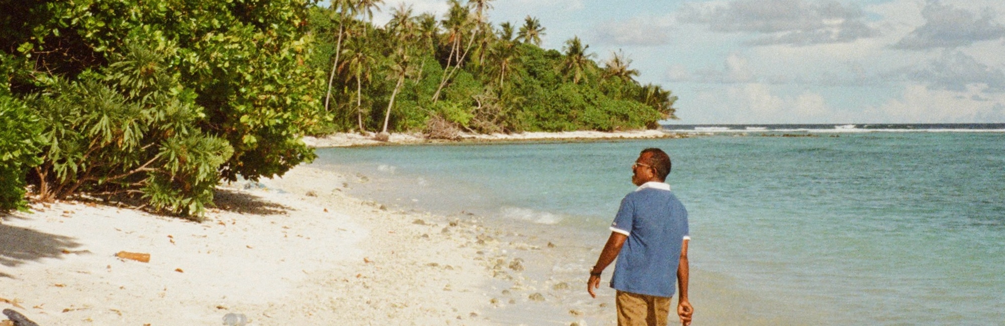 maldivian captain on the beach on a deserted island