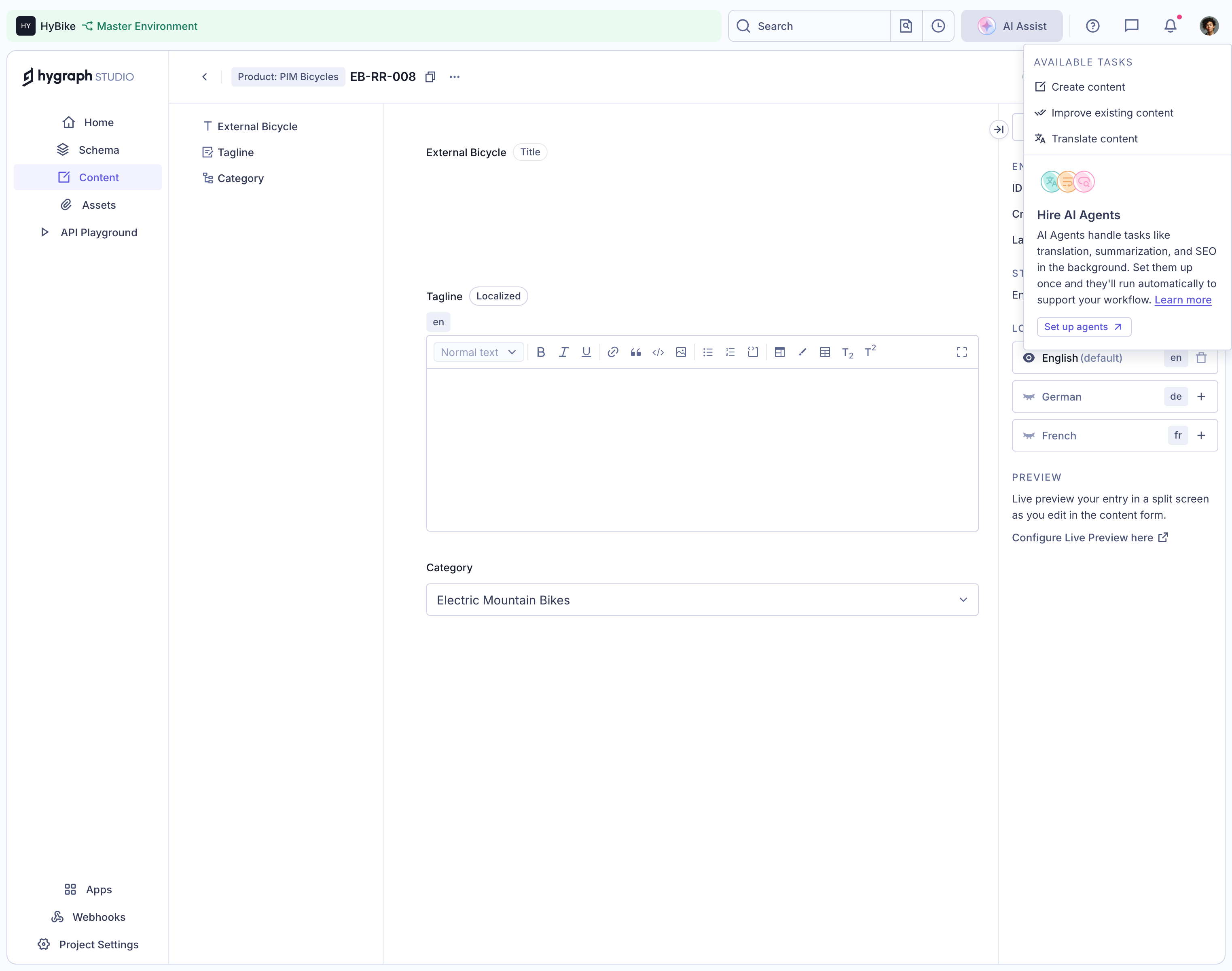 Hygraph Studio localized Tagline field with a blank rich text area, persistent formatting toolbar, English locale and language choices in a side panel