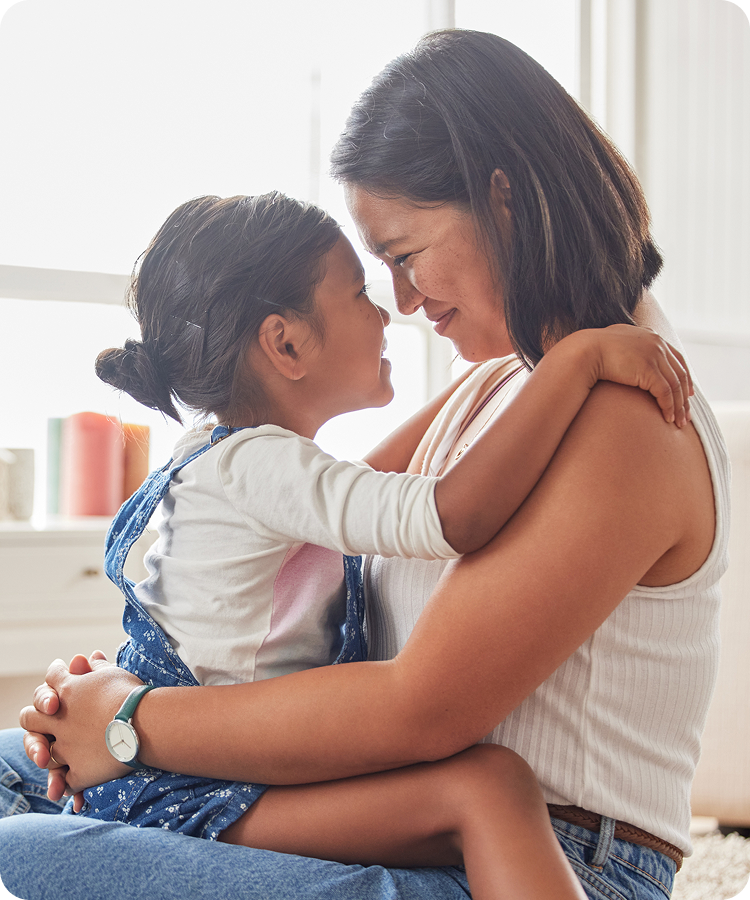 A parent holding a child