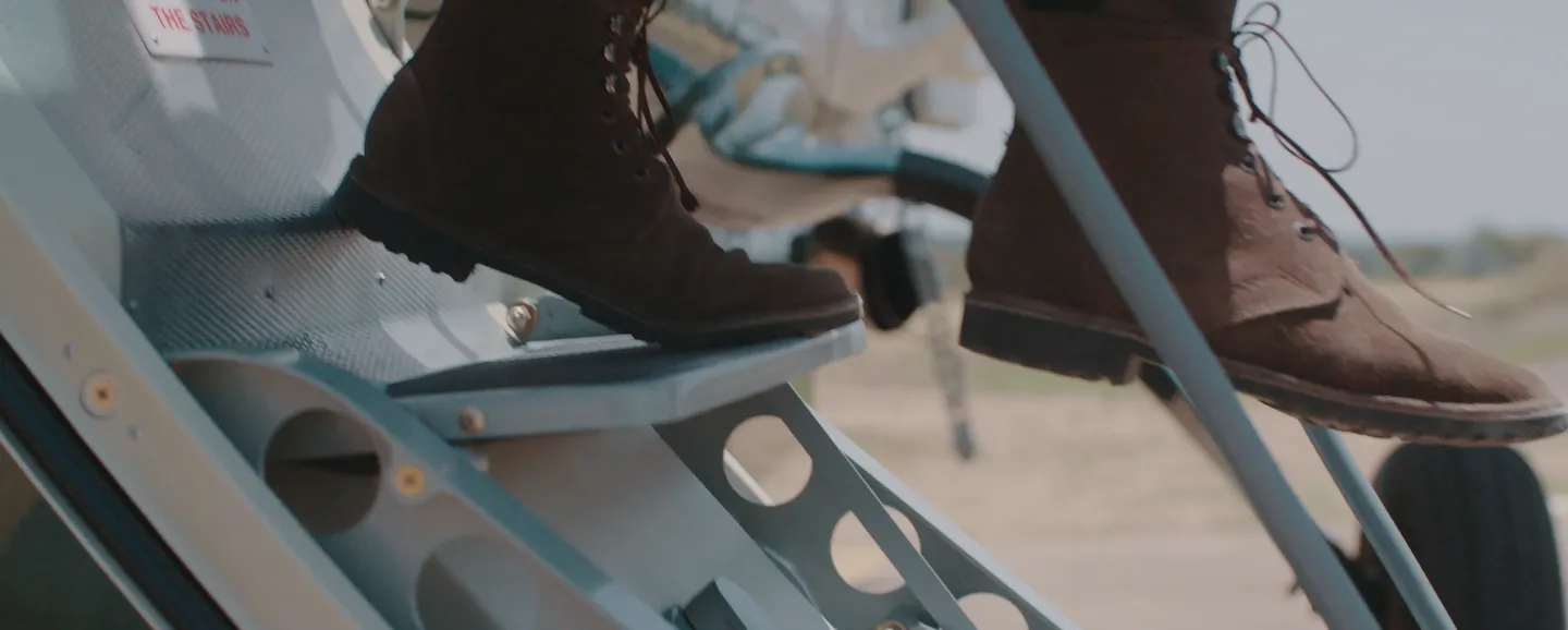 Safari boots stepping off plane