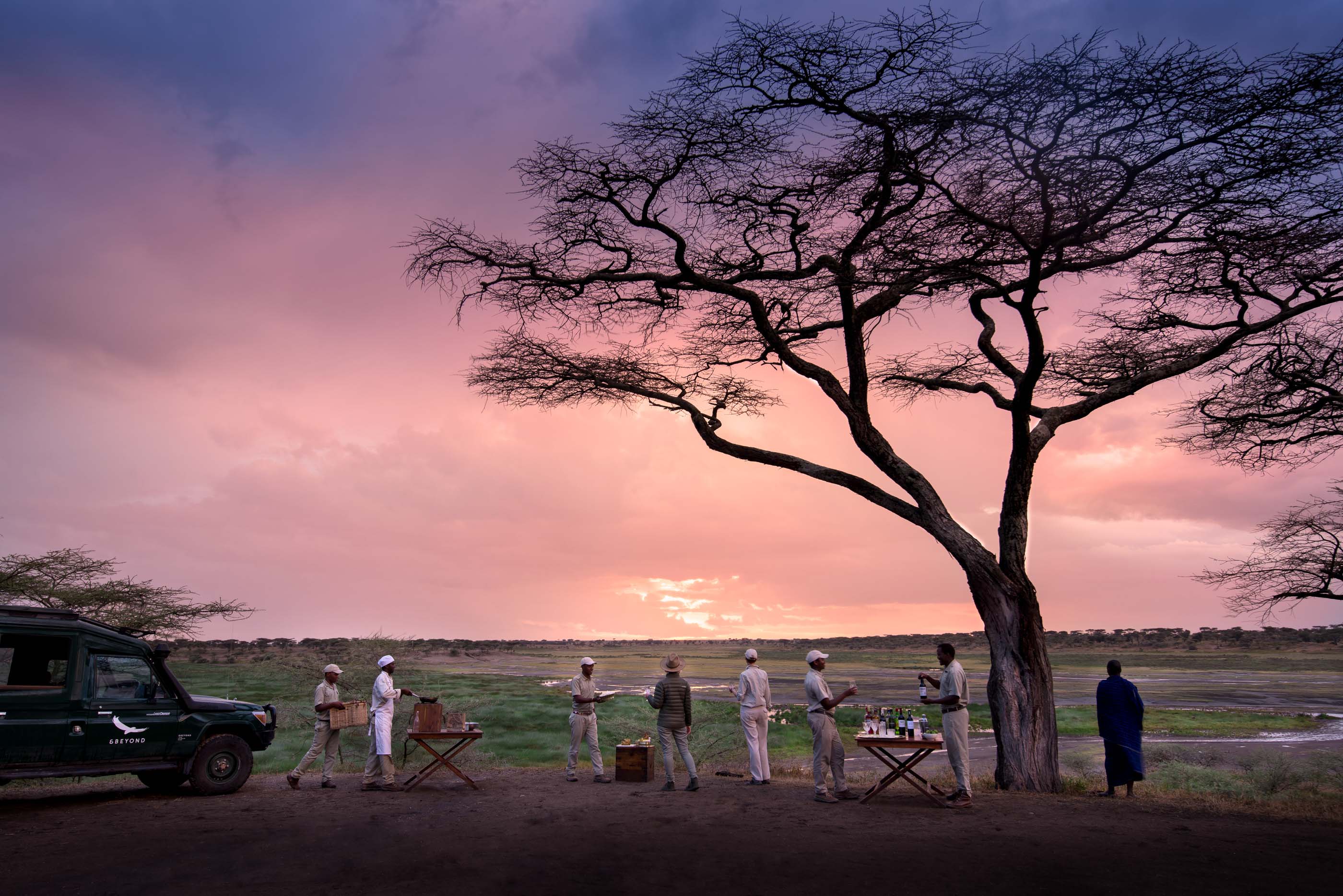 Sundowner drinks on the serengti plains. AndBeyond