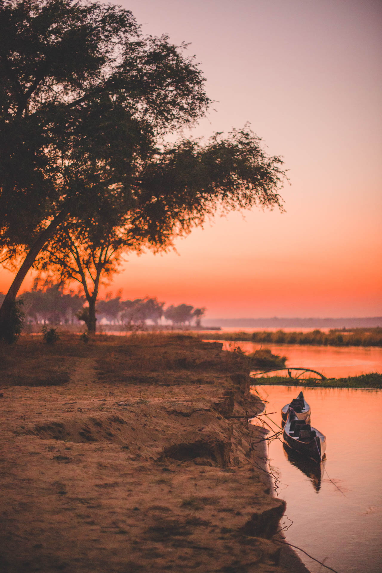 A canoe on the banks of the Zambezi River at sunset