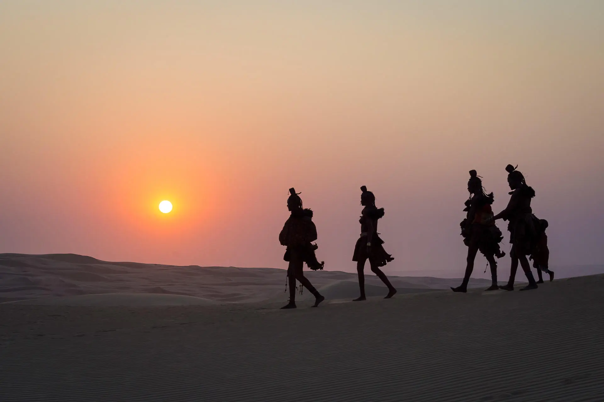 Himba women walking in Namib desert