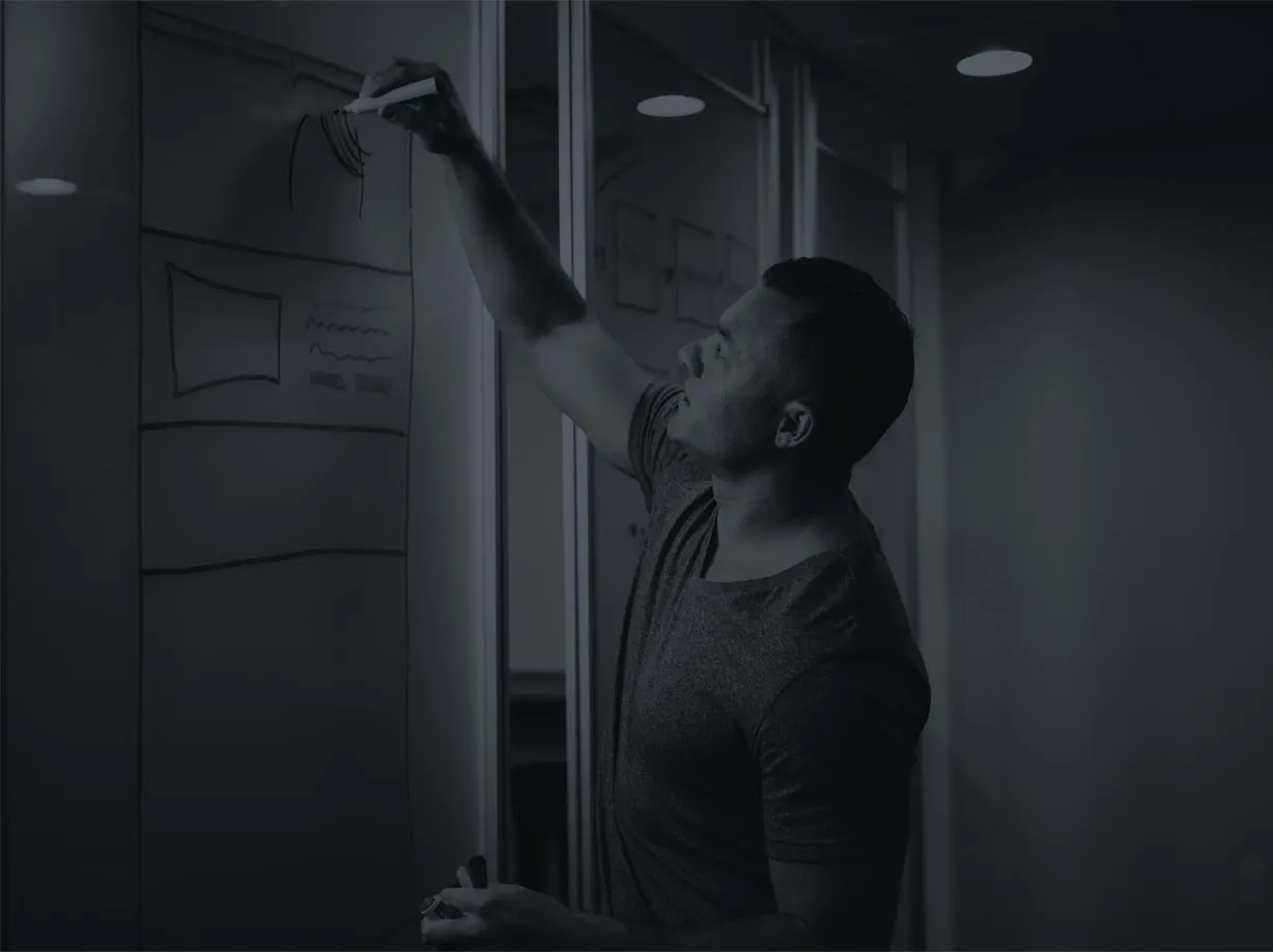 Photo of Dental Marketing expert Joshua Scott writing on a whiteboard