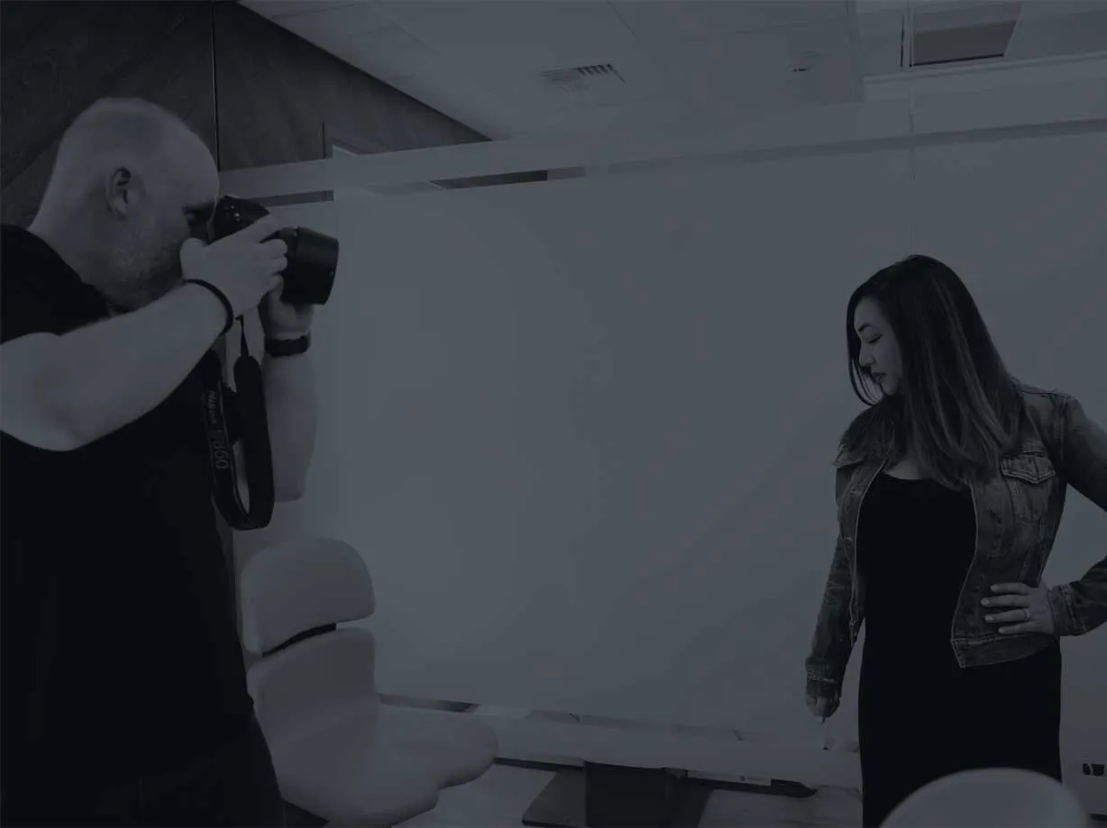 Photo of a photographer taking a picture of a dentist