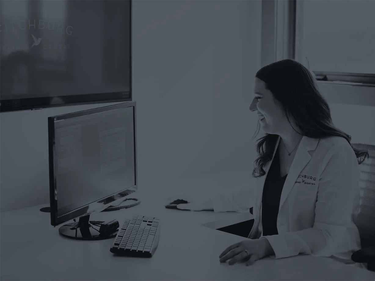 Photo of a dentist using a computer