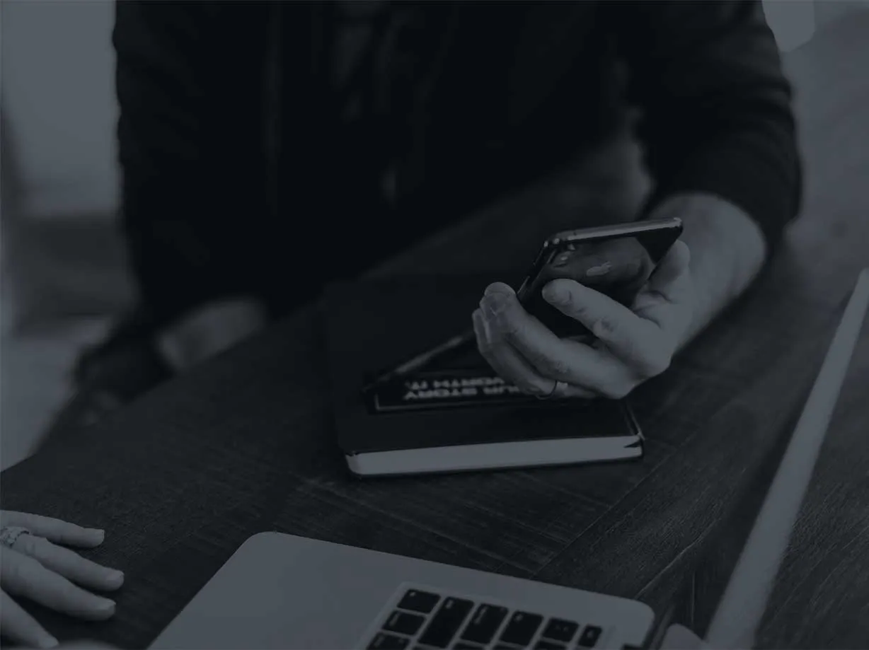 Photo of a hand holding a phone