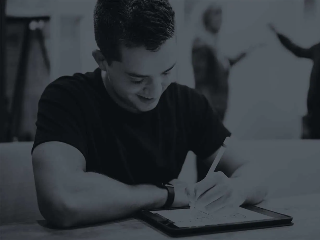 Photo of a man using an iPad