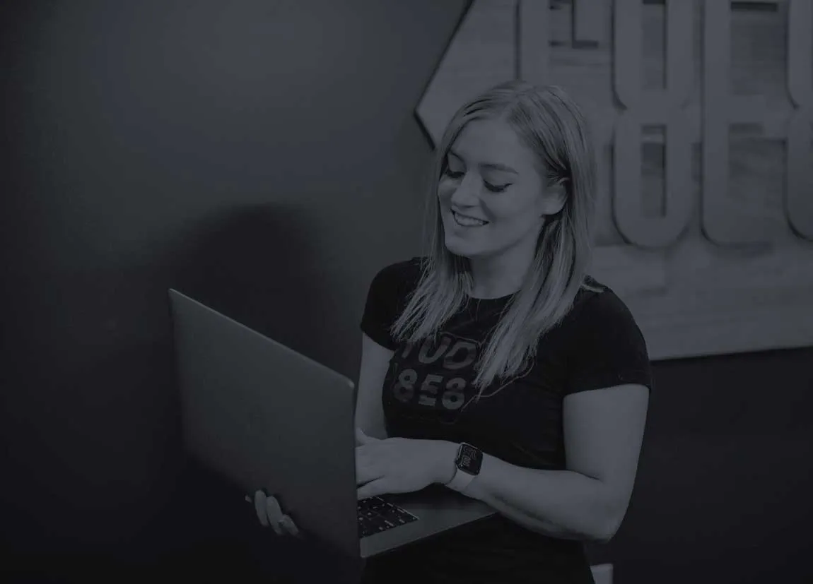 Photo of a Studio 8E8 team member looking at a dental website on a computer