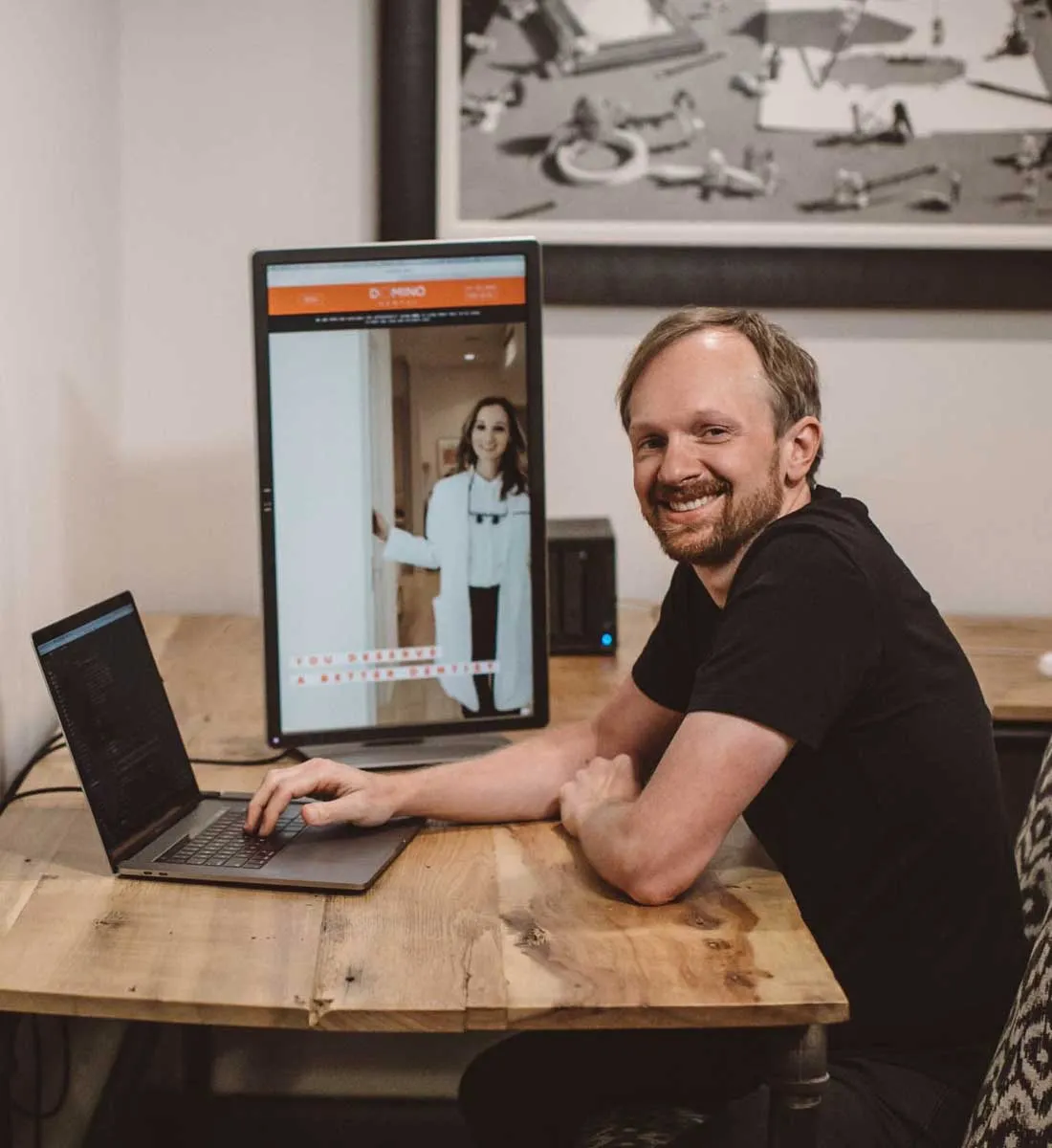 Photo of Joe, our lead web developer and COO, developing the website for Domino Dental