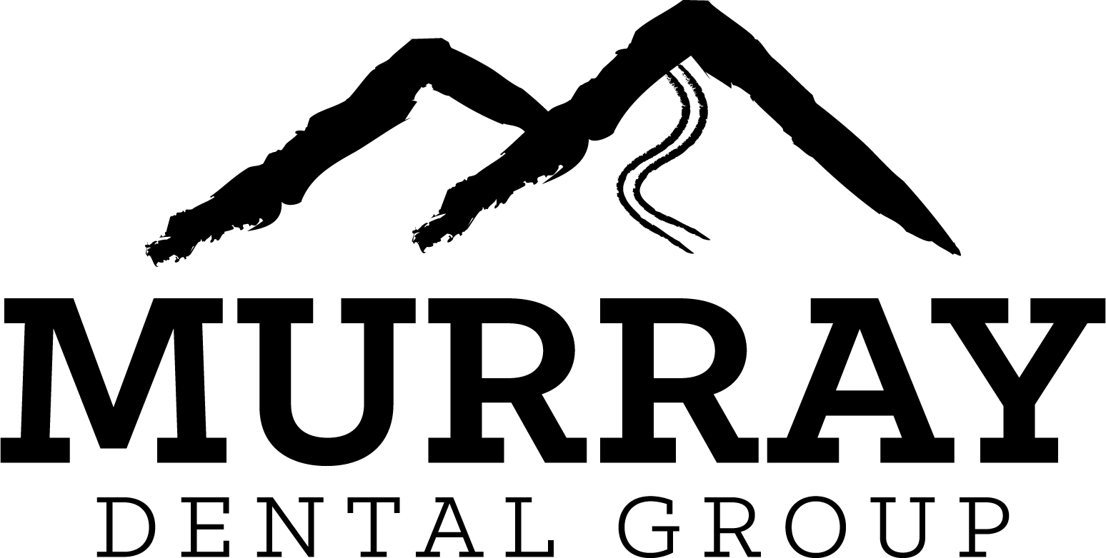 Silhouette of mountains against a plain background, characterized by its sharp, angular structure.