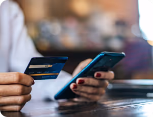 Icon of a shopping bag set against a blue circular background, symbolizing retail and consumerism.