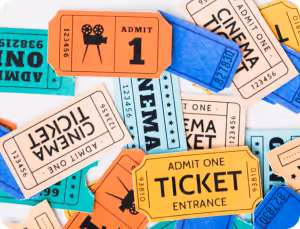 A close-up of a pile of tickets featuring the phrase "attend one" prominently displayed on the top ticket.