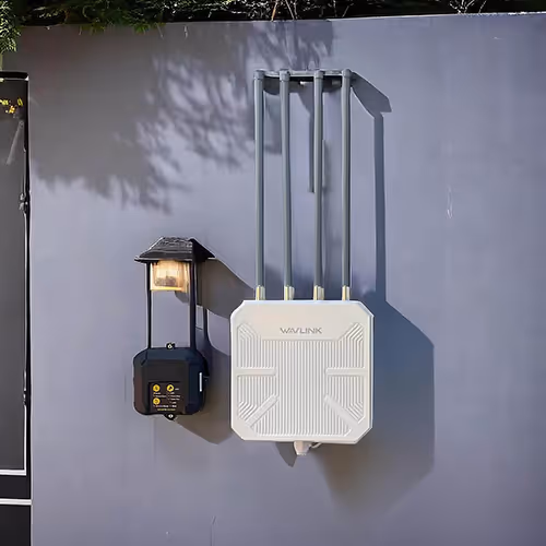 A white wall-mounted outdoor antenna alongside a light fixture, designed for enhanced connectivity and illumination.