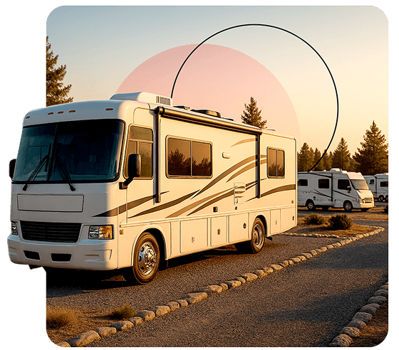 Class A motorhome parked on a gravel loop at sunset in a pine-lined RV park