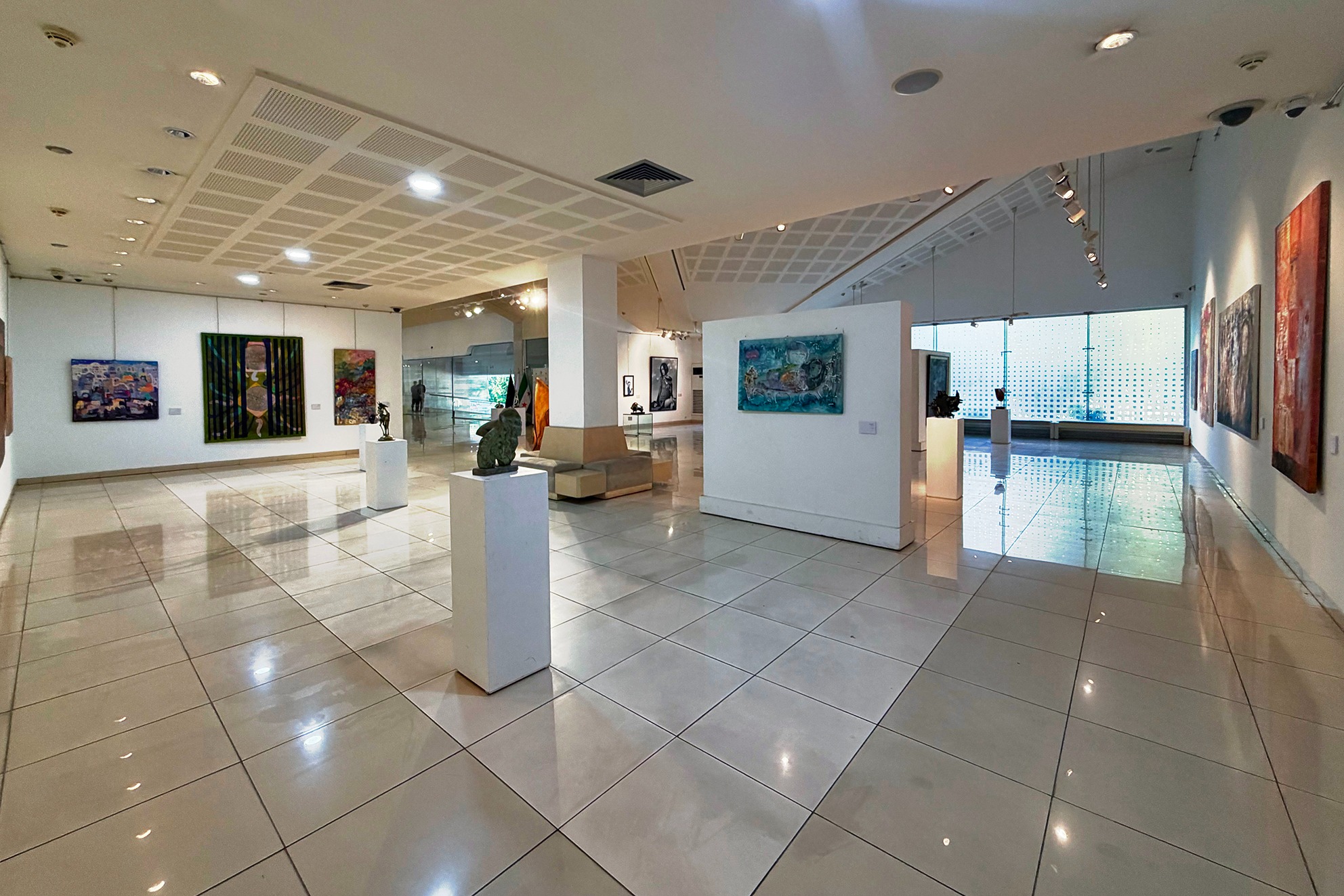 Paintings and sculptures installed throughout the gallery at Art Leaves Its Mark, 2026. Photograph by Khaled Barakeh.