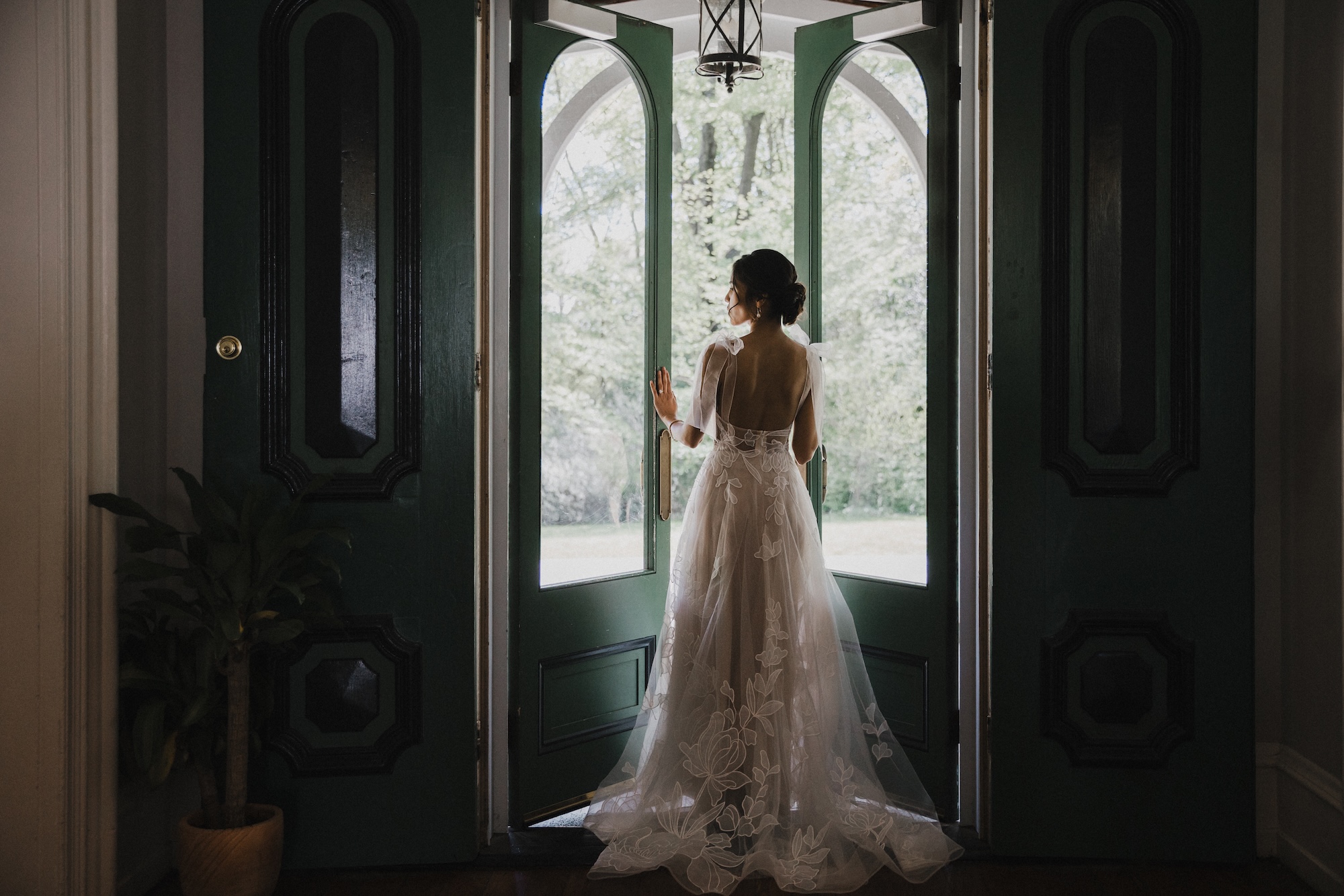Bride in entry doorway of the Cope House at Portico Awbury Arboretum