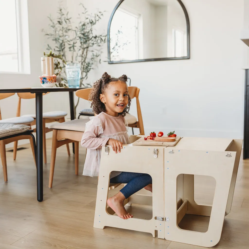 Kid seating on the Mini Chef Convertible
