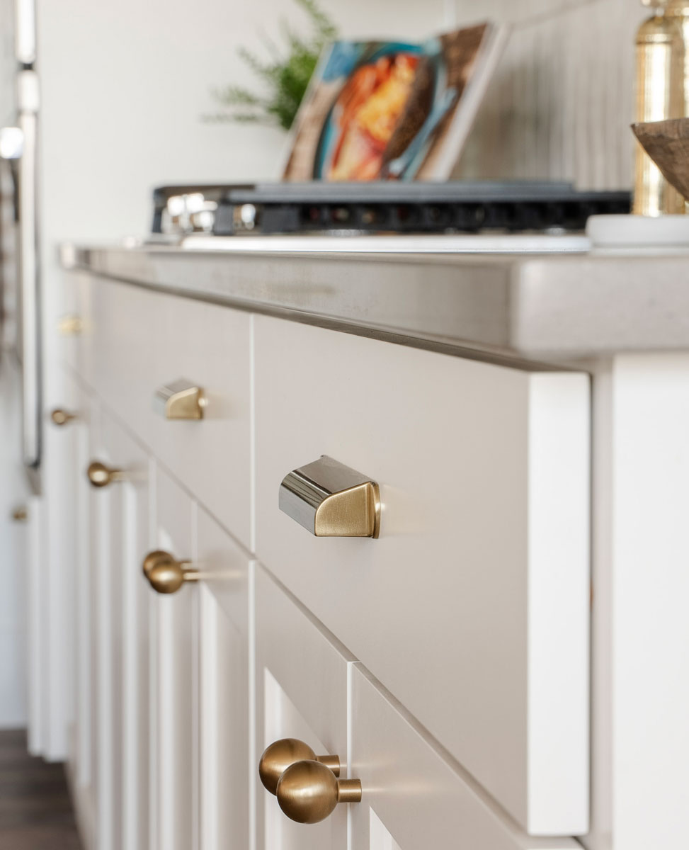 Brass hardware on white cabinets