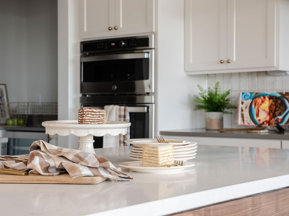 Cake sitting on counter in semi-custom kitchen