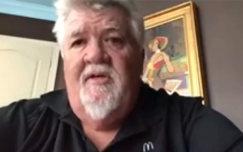 mike speaking to camera