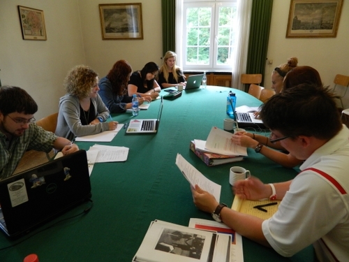 people working a table