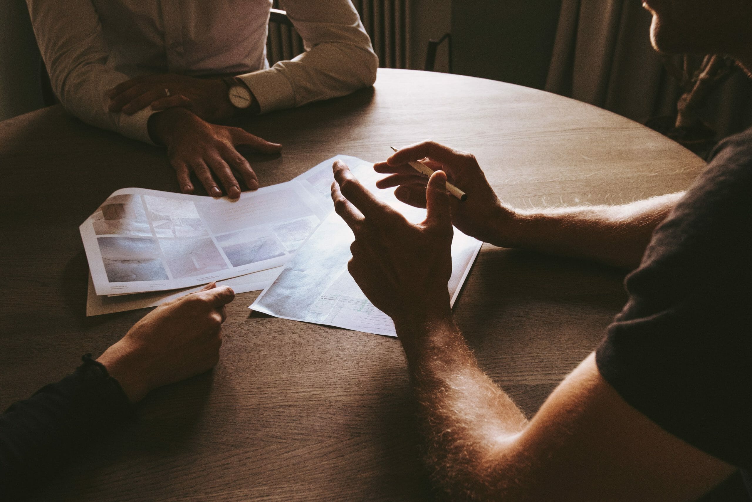 people sitting around a table in a discussion