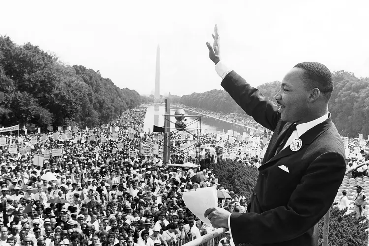 Dr. Martin Luther King Jr waves at a crowd in Washington D.C.