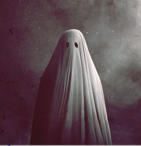 a ghost standing in front of the night sky
