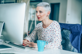 Woman accessing files on a computer